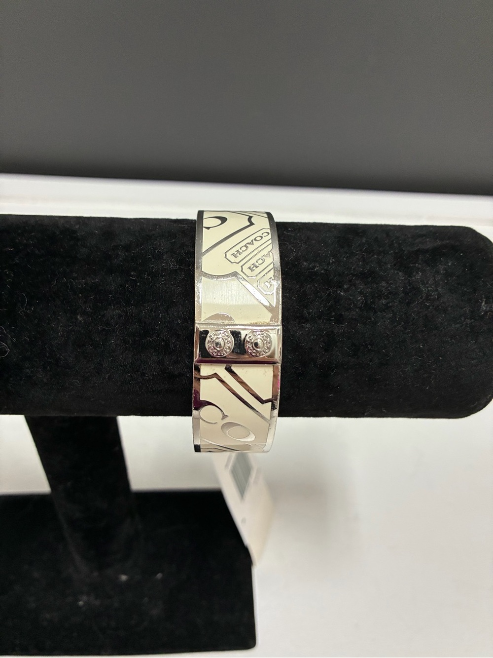 Coach Silver-Tone Logo Bangle Bracelet with Crème Enamel